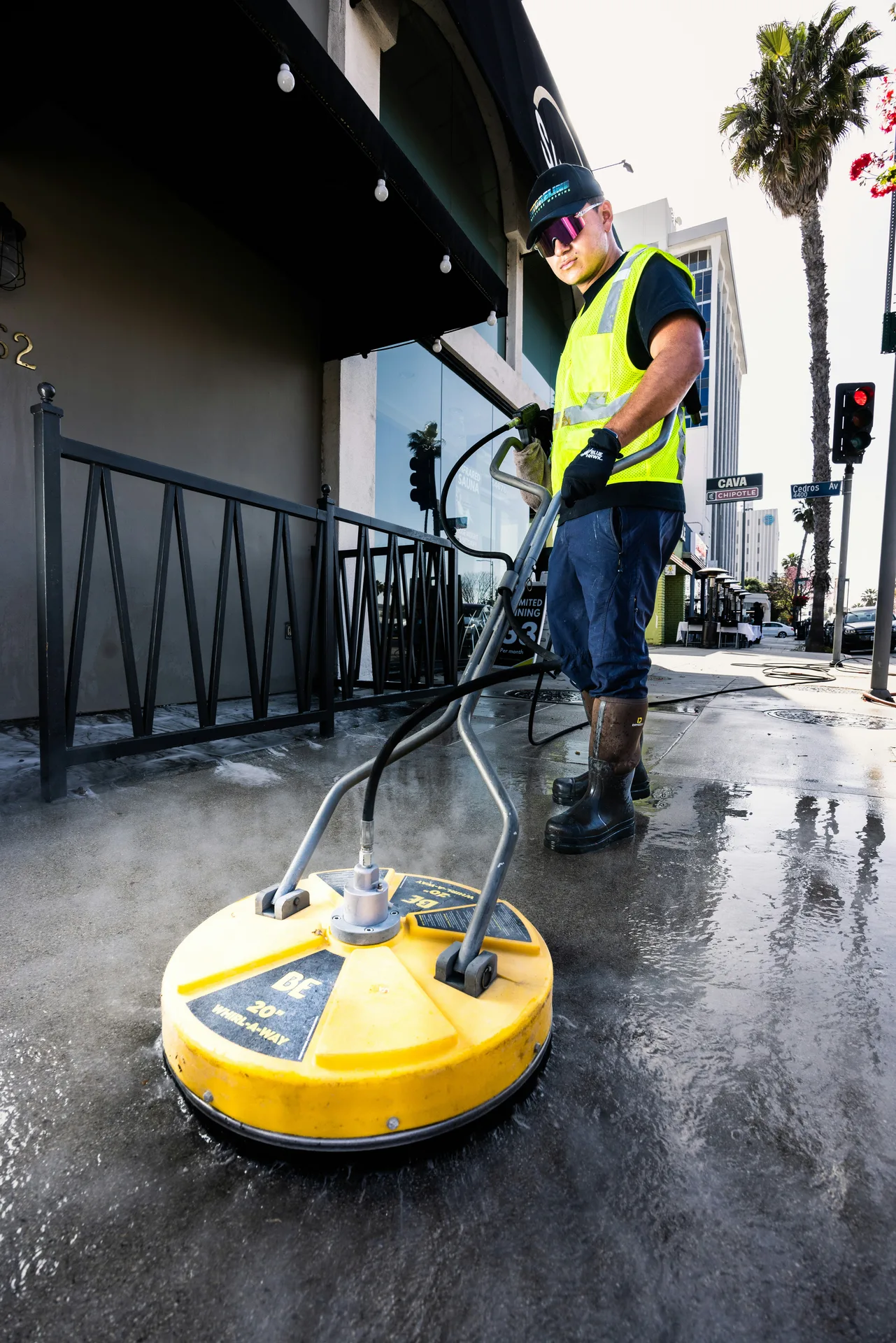 Hamilton pressure washing crew working on a wood deck restoration